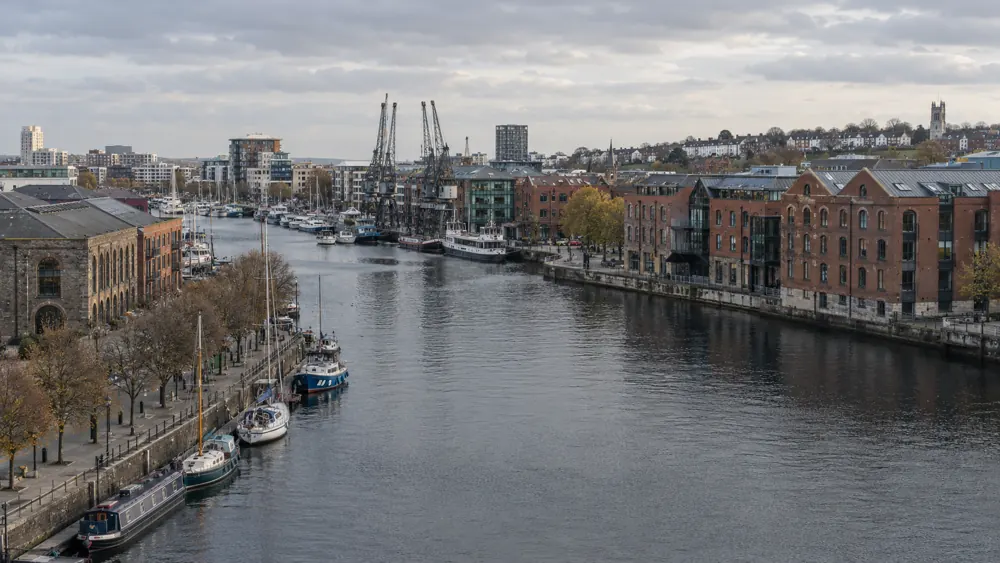 Bristol harbour with brick waterfront buildings and cranes
